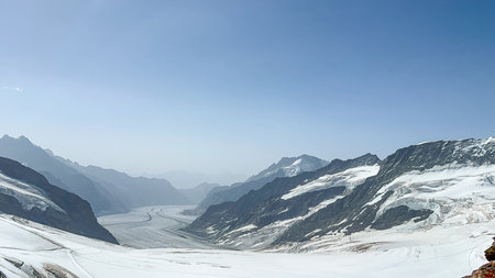 Majestic view of the Aletsch Glacier, the largest glacier in the Alps, Switzerland. A pristine landscape of snow-capped mountains and icy valleys.の写真素材