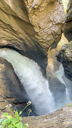 The Aare Gorge (Aareschlucht) is a section of the Aare river that carves through a ridge of limestone rock near Meiringen, Switzerland. A dramatic display of nature's power.の写真素材