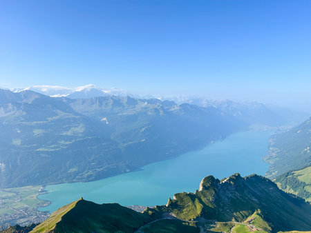 Breathtaking view from Brienzer Rothorn. Turquoise Lake Brienz and the Swiss Alps create a majestic panorama. Perfect for hiking and nature lovers.の写真素材