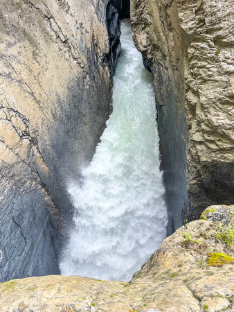 A view of the impressive TrÃ¼mmelbach Falls, Lauterbrunnen, Switzerland. This series of ten glacier-fed waterfalls are located inside a mountain and are a UNESCO World Heritage site.の写真素材