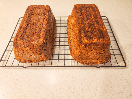 Two loaves of homemade bread cooling on a rack. Delicious and wholesome!
