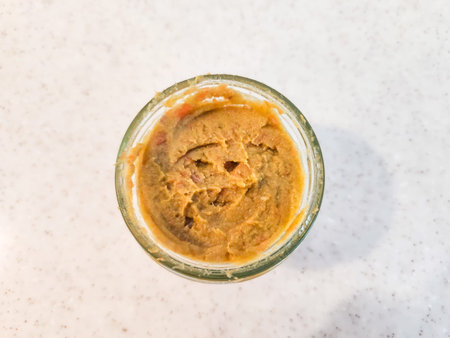 Overhead view of a jar filled with a homemade spread.の写真素材