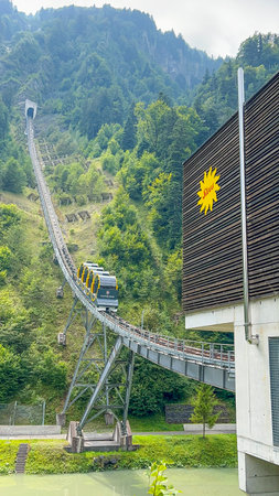 View of the Stoosbahn funicular in Stoos, Switzerland. The world's steepest funicular railway climbs up the mountain, providing panoramic views of the Swiss Alps.の写真素材