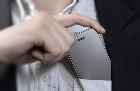 Mobile phone in your Pocket  young manの写真素材