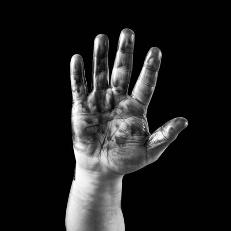dirty men hand on a black backgroundの写真素材