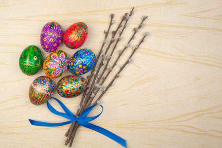 Easter still life. Hand-painted eggs and willow twigs. Place for text