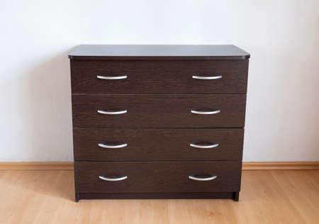 Chest of drawers with four drawers and metal handles. Step-by-step instructions for assembling a...