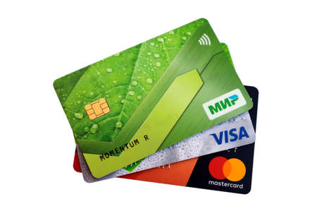 Bank cards Visa, Mastercard and the Russian payment system Mir. Close-up. Novosibirsk, Russia. March...