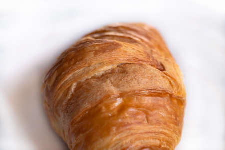 Fresh, tasty croissant close-up. macro photography, selective focus