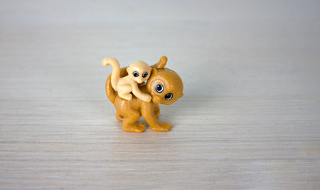 A monkey toy and her baby a small monkey on her back. motherhood conceptの写真素材