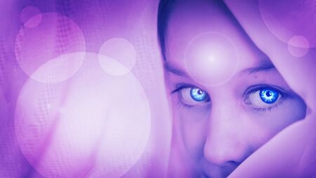 Artistic abstraction of a girl with a shrewd look. On forehead luminous star is symbol open mind.の写真素材