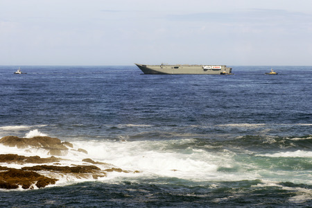 Punta langosteira new port, Coruna, Spain; first operation; August, 4 2012; HMAS Canberra loaded in HTV Blue Marlin, Dockwise.のeditorial素材