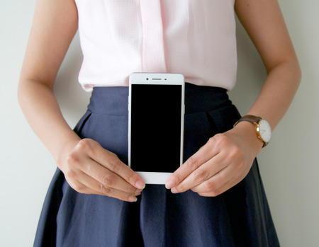 Girl hand holding Handphoneの写真素材