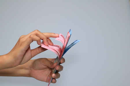 woman hand showing rupiah Indonesian money