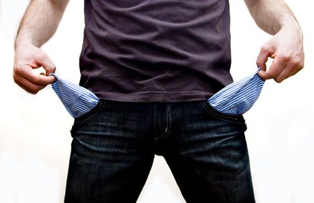 Casual looking man showing his empty pockets