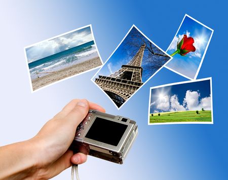 Digital point and shoot camera and pictures against blue skyの写真素材