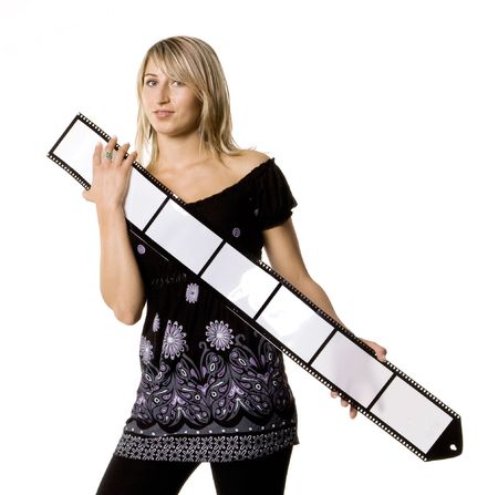 Beautiful young woman holding blank film stripの写真素材