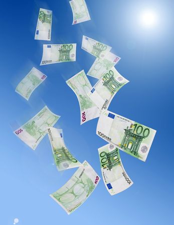 One hundred euro banknotes falling from the skyの写真素材