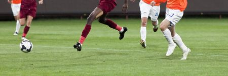 Soccer player kicking the ballの写真素材
