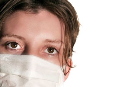 Woman with big green eyes wearing medical mask protecting against flu virusの写真素材