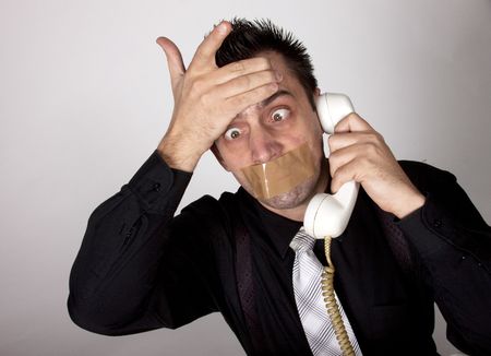  Funny businessman with tape on his mouthの写真素材