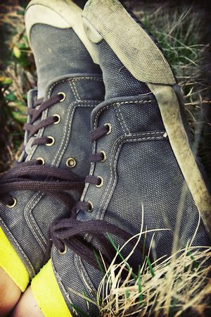 Retro styled sneakers in grassの写真素材