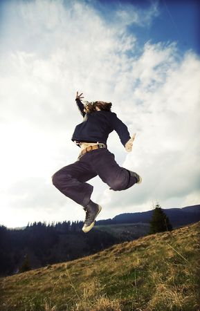 Woman with sneakers jumpingの写真素材