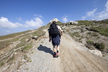 Man trekking in high mountains の写真素材