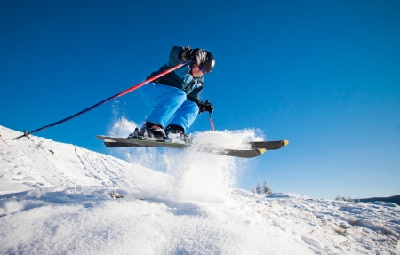 Man practicing extreme ski on sunny day の写真素材