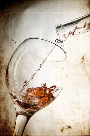 Red vine in glass on vintage background の写真素材