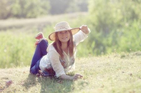 Beautiful blonde woman on meadow の写真素材