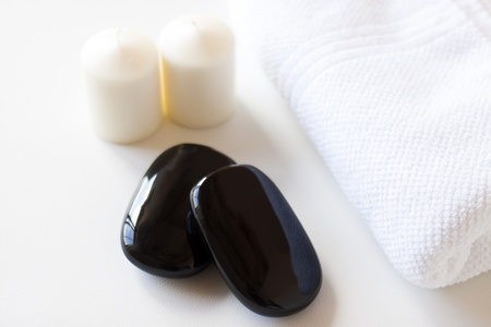 Spa with black stones on a towel
