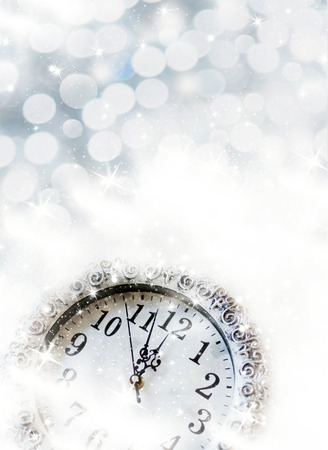 Clock and fireworks at midnightの写真素材