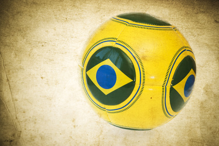 Vintage photo of Brazil flag and soccer ballの写真素材