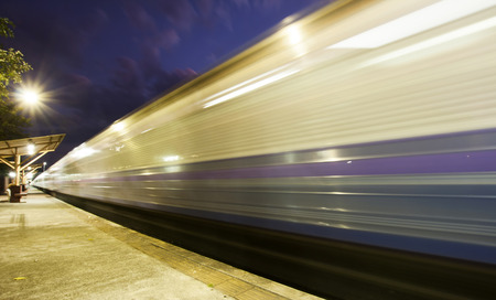 Train in motion - light trail at night 