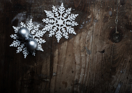 Snowflakes on grunge wooden background. Winter holidays conceptの写真素材