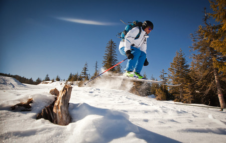 Man practicing extreme ski on sunny dayの写真素材