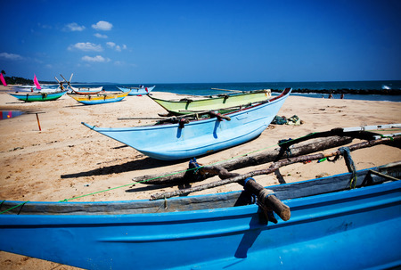 tropical beach with fishing boats in Sri-Lankaのeditorial素材