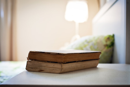 bedroom with books on nightstand