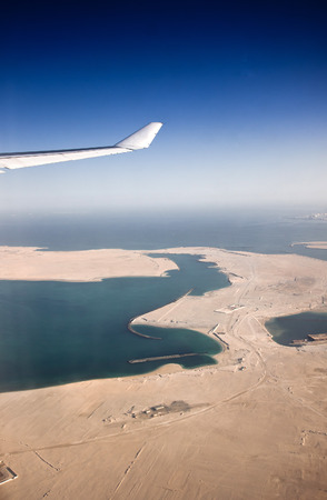 Plane wing and clouds viewed from airplaneの写真素材