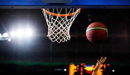 basketball going through hoopの写真素材