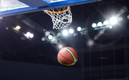 basketball going through hoopの写真素材