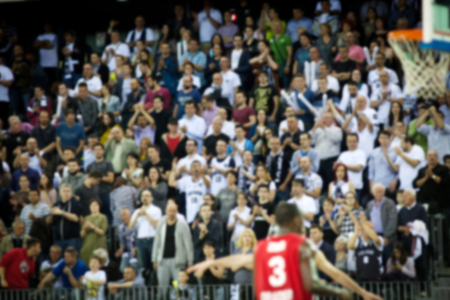 Blurred background of crowd of people in a basketball courtの写真素材