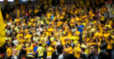 Blurred background of crowd of people in a basketball courtの写真素材