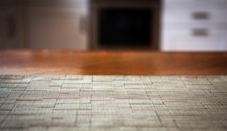 Blurred kitchen interior and napkin and desk spaceの写真素材