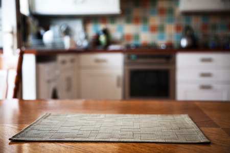 Blurred kitchen interior and napkin and desk spaceの写真素材