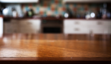 Blurred kitchen interior and napkin and desk spaceの写真素材