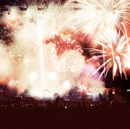 cheering crowd watching fireworks at New Year - holiday celebration backgroundの写真素材