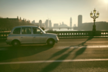 blurred background of traffic on Westminster Bridge with typical English cabs and busesの写真素材