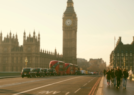 blurred background of traffic on Westminster Bridge with typical English cabs and busesの写真素材